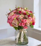 Country pinks tones floral arrangement by Shaws of Covent Garden