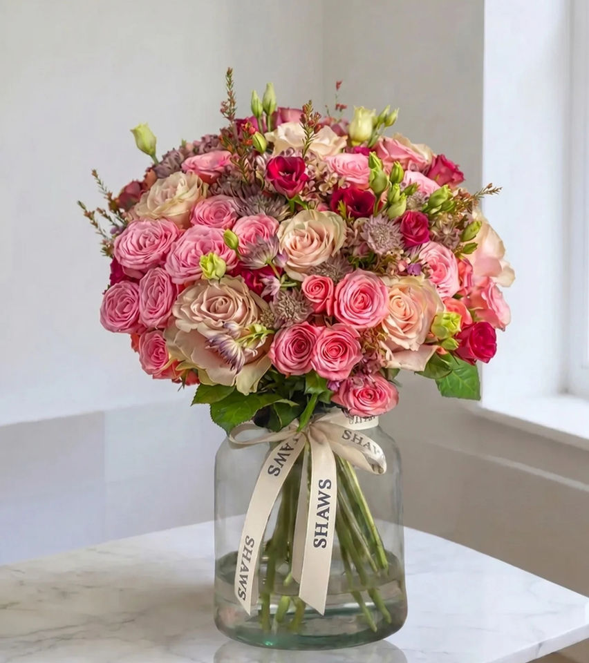 Country pinks tones floral arrangement by Shaws of Covent Garden