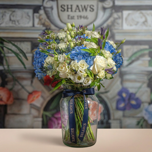 Beautiful country blues floral arrangement by Shaws of Covent Garden