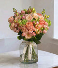 Peaches and cream floral arrangement by Shaws of Covent Garden